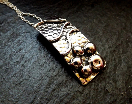 Silver pebble and wave textured sea lover pendant necklace