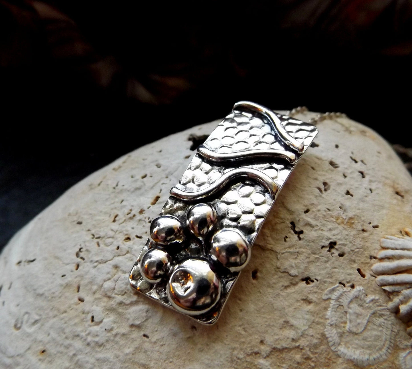 Silver pebble and wave textured sea lover pendant necklace