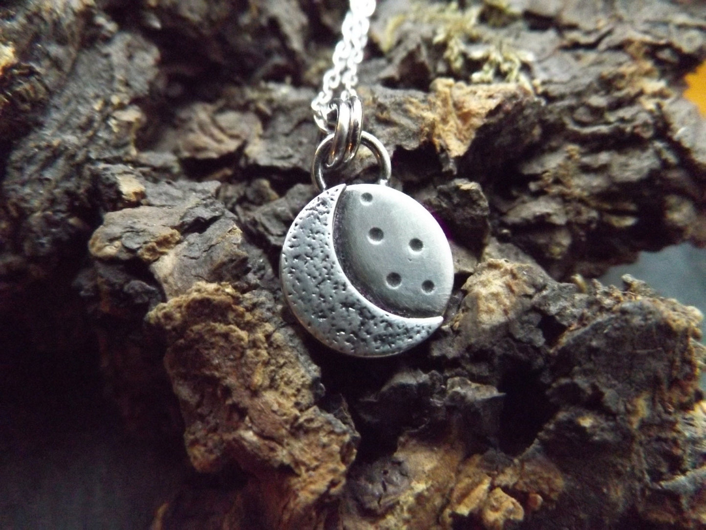 Silver crescent moon necklace with textured background and brushed polished finish , small moon pendant