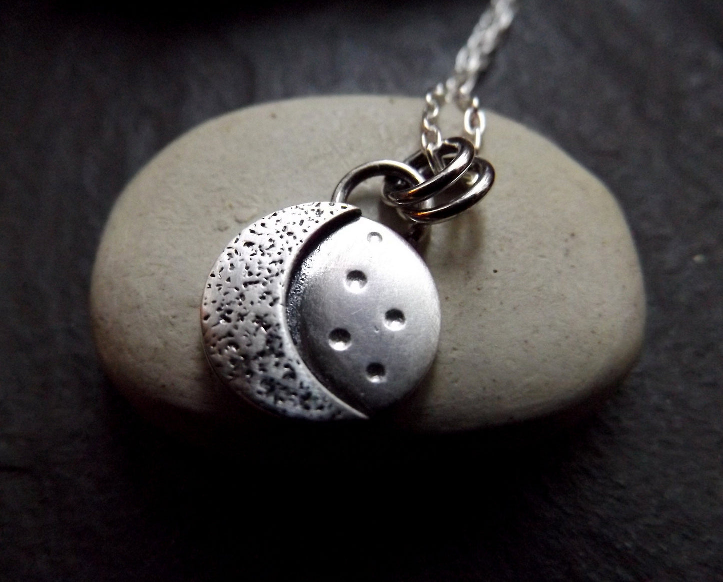 Silver crescent moon necklace with textured background and brushed polished finish , small moon pendant