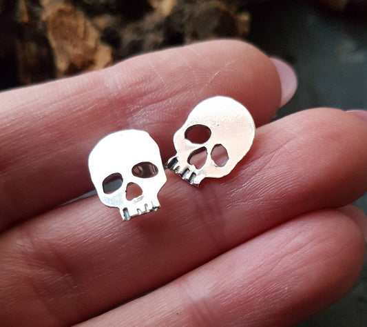 Silver skull stud post earrings , mismatched quirky skull earrings