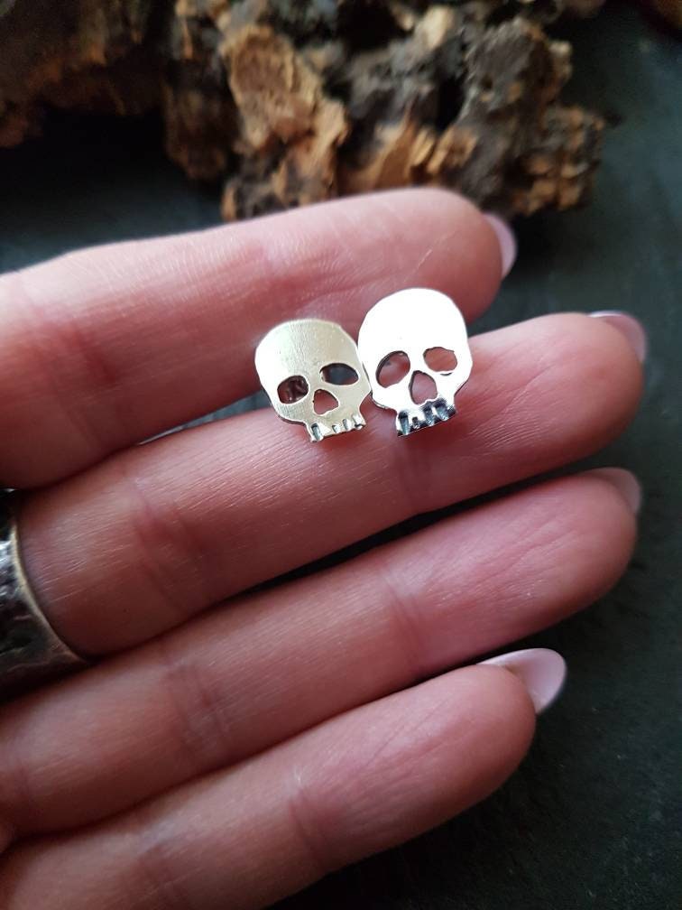 Silver skull stud post earrings , mismatched quirky skull earrings