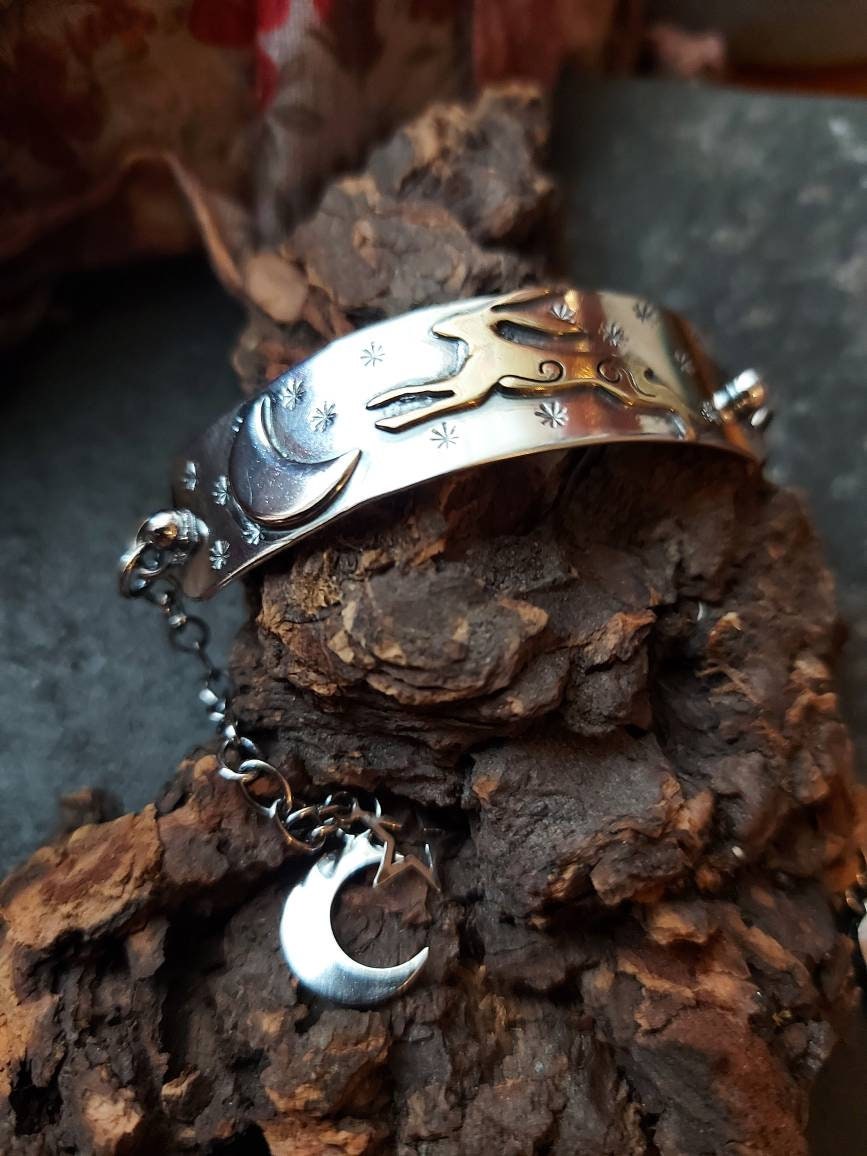Silver leaping hare with Moon and Stars bar bracelet with star and moon charms, and brass hare