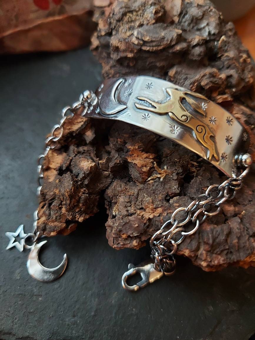 Silver leaping hare with Moon and Stars bar bracelet with star and moon charms, and brass hare