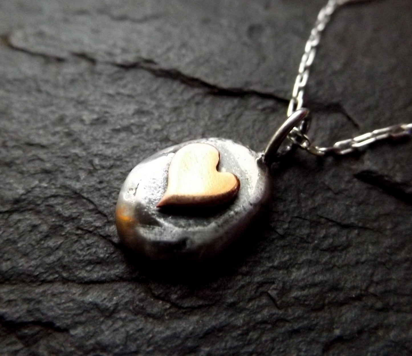 Silver pebble necklace with copper heart , mixed metal heart necklace