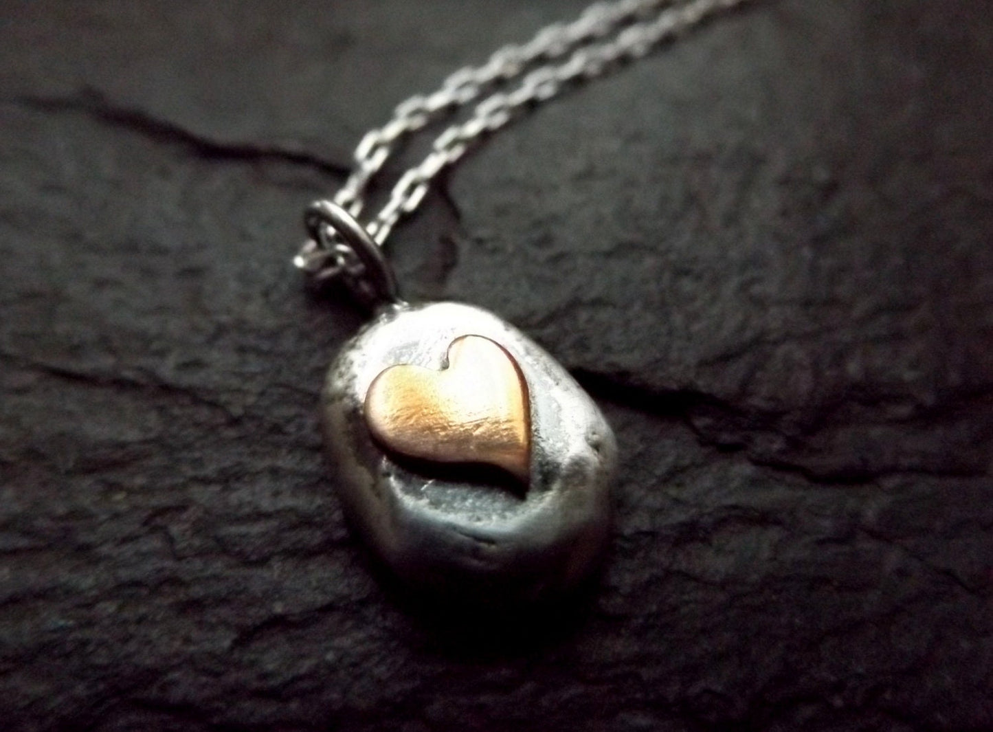 Silver pebble necklace with copper heart , mixed metal heart necklace