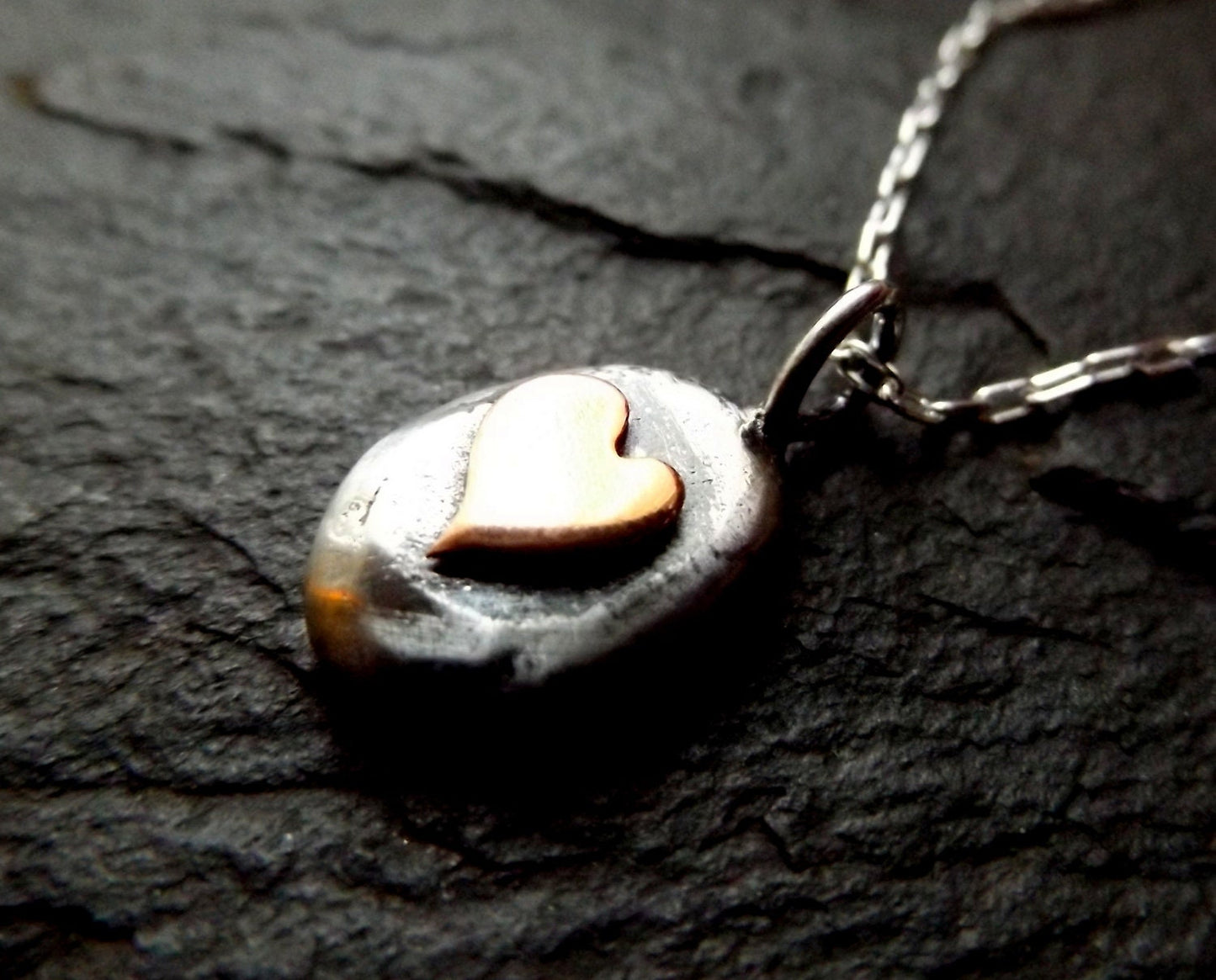 Silver pebble necklace with copper heart , mixed metal heart necklace