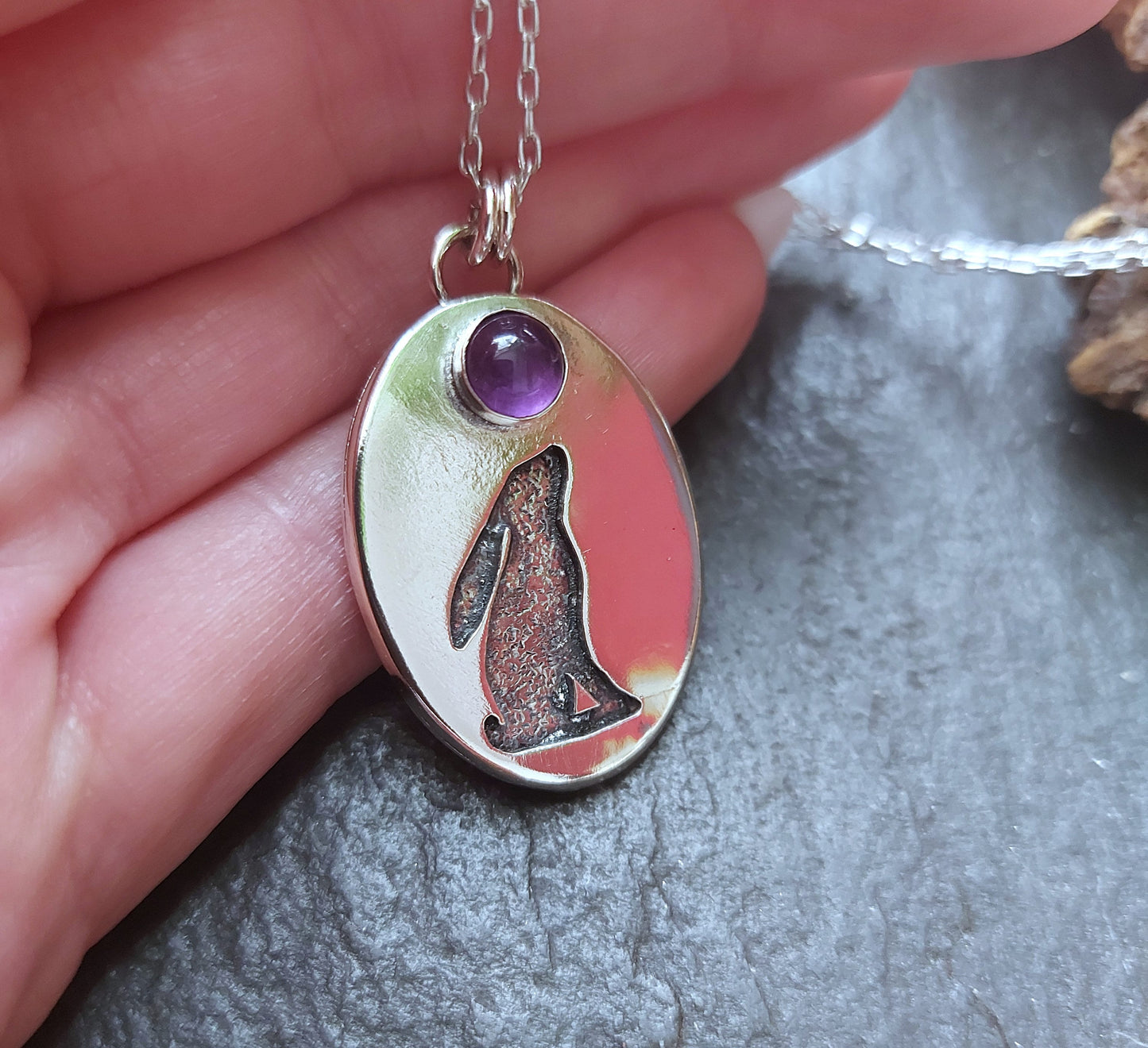 Silver oval hare pendant with textured background and 6mm amethyst , cut out hare pendant