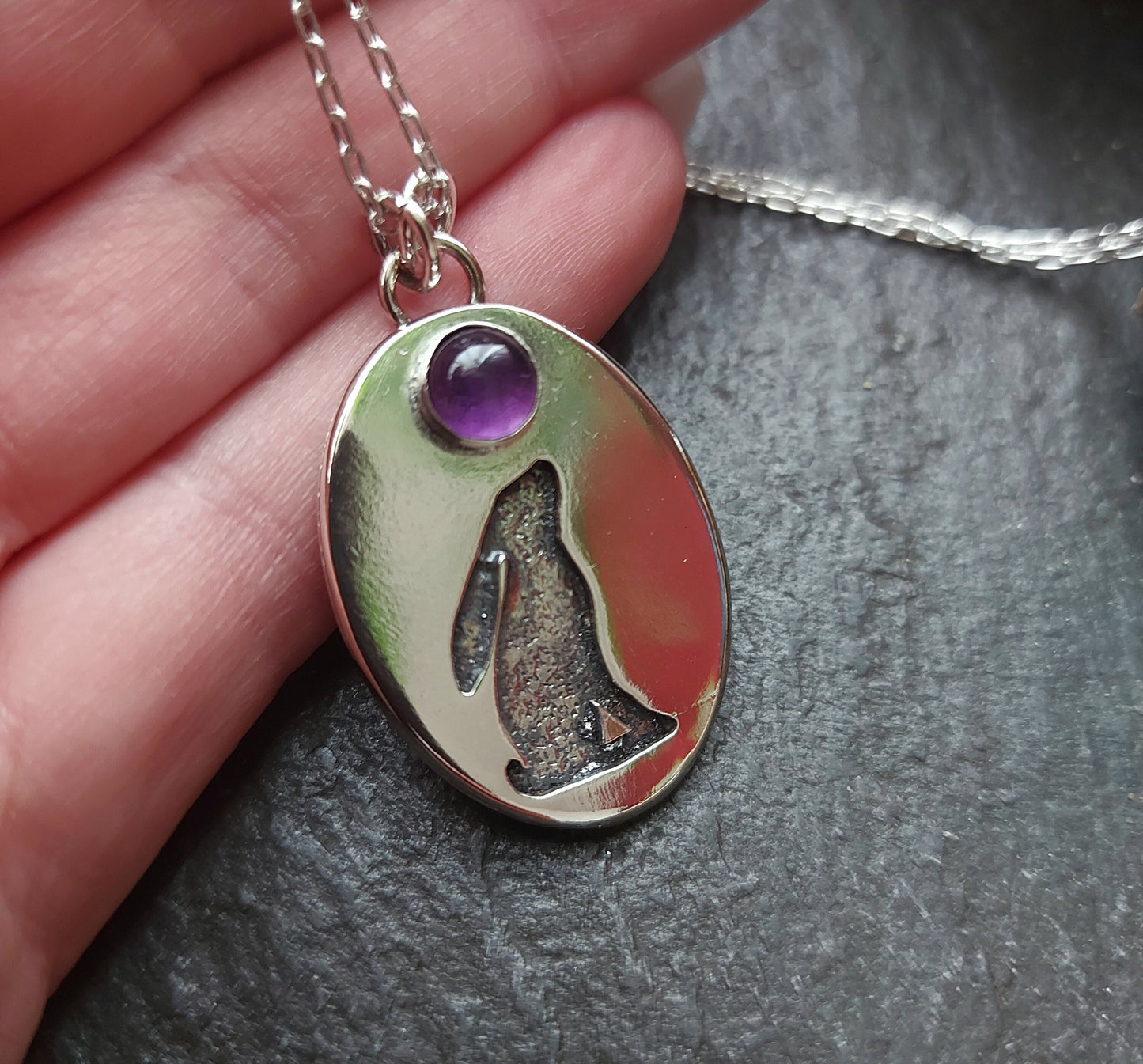 Silver oval hare pendant with textured background and 6mm amethyst , cut out hare pendant
