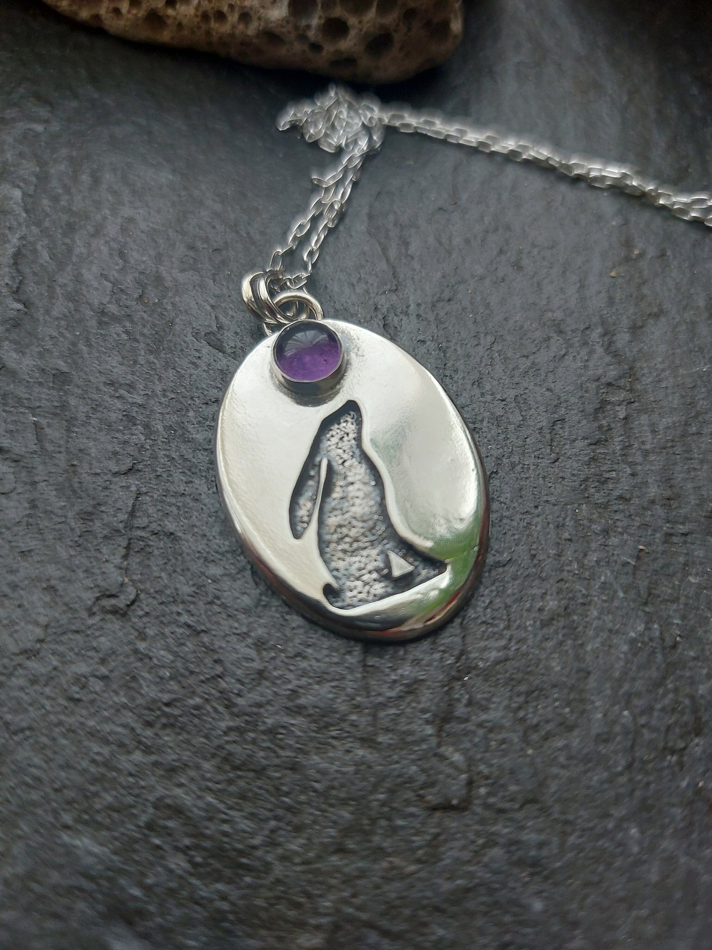 Silver oval hare pendant with textured background and 6mm amethyst , cut out hare pendant